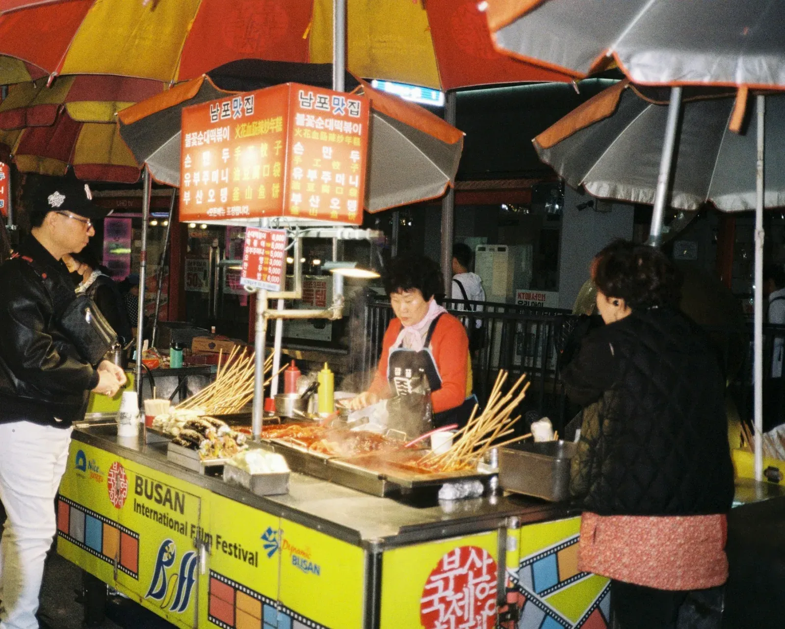 Market stalls and signs in Busan